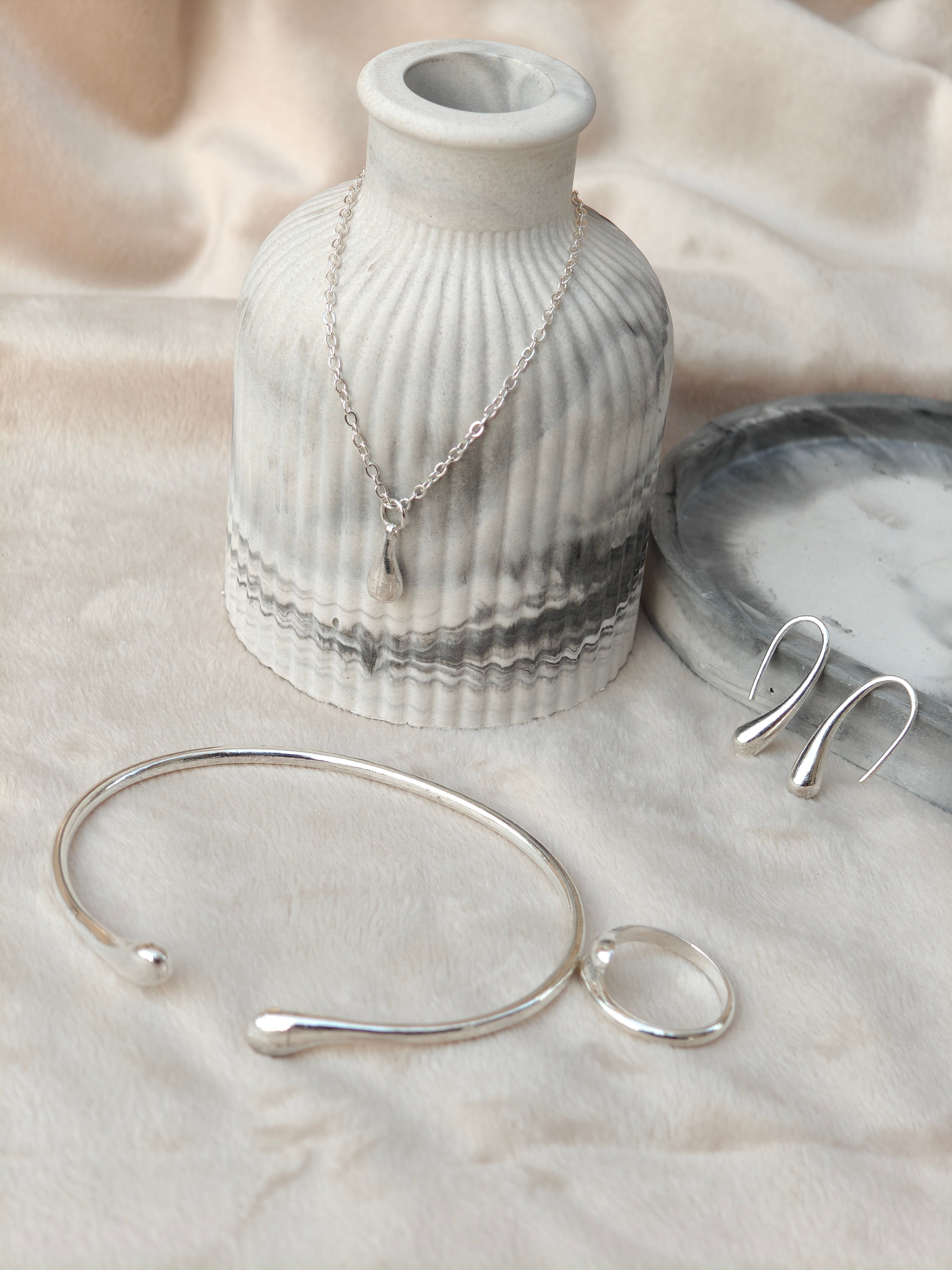 Aura Liquid Teardrop 4-Piece Silver Jewellery Set - Necklace, Bangle, Ring, and Earrings close up view