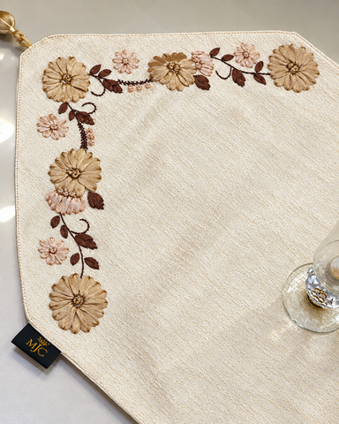 Close-up of Noor floral hand embroidered table runner and matching tissue box cover set