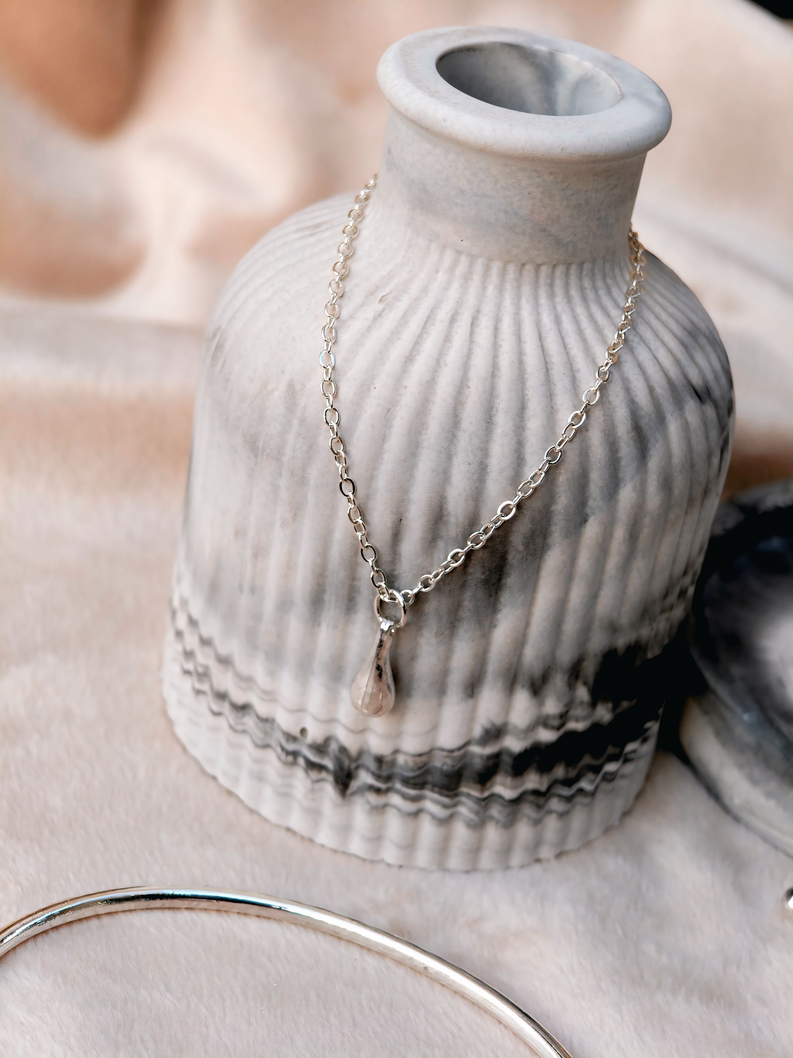 Aura Liquid Teardrop 4-Piece Silver Jewellery Set - Necklace, Bangle, Ring, and Earrings close up view