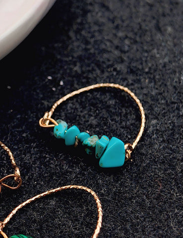 Turquoise beaded bracelet on a dark surface